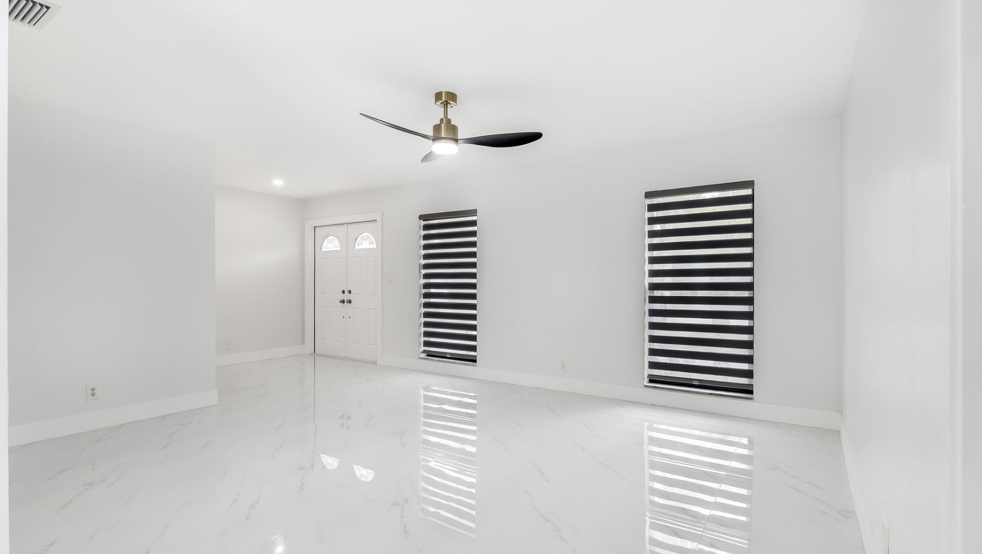 Bright foyer entry with marble floors
