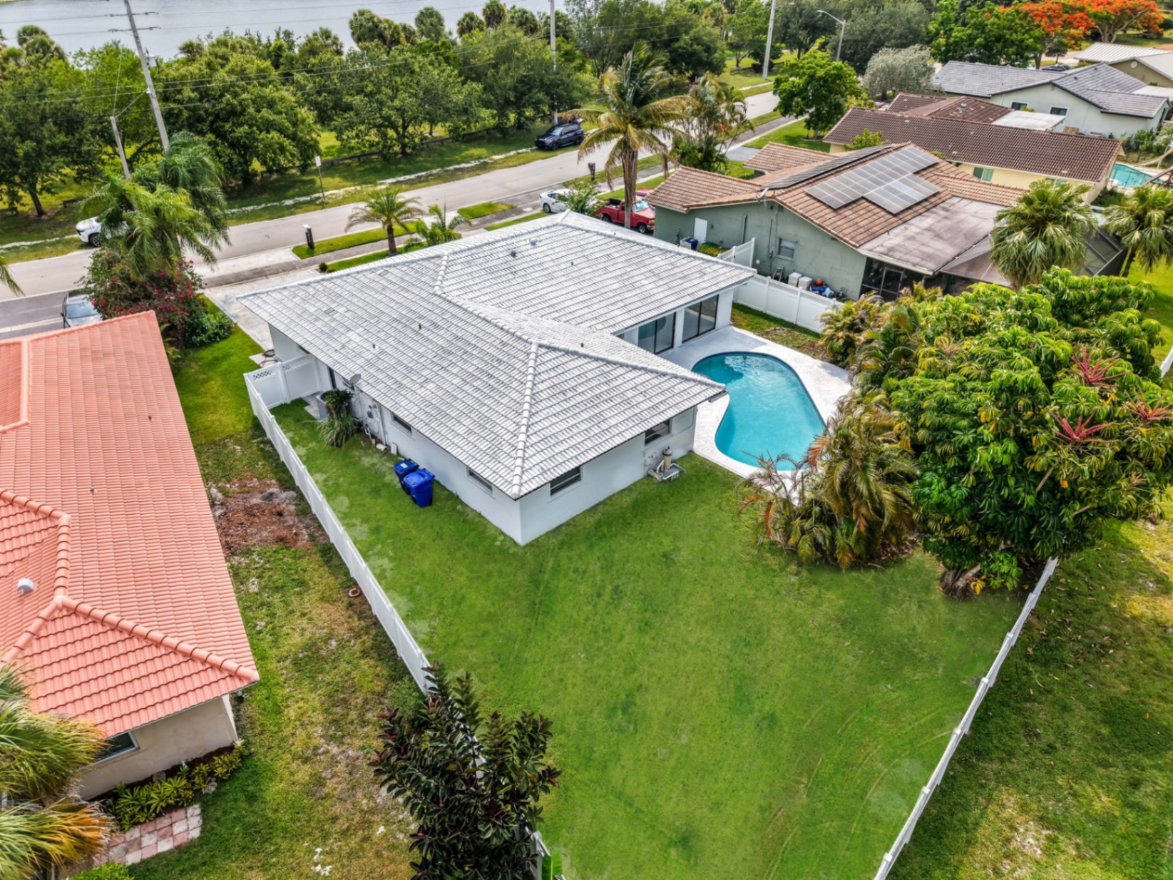 Fully fenced backyard with mature landscaping