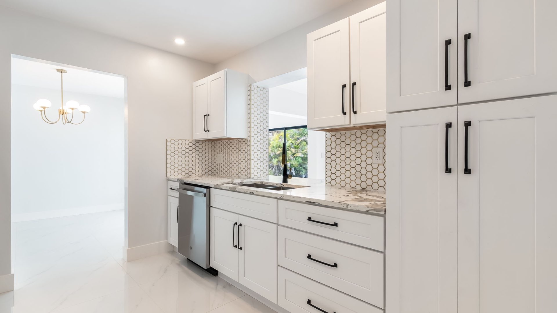 Kitchen cabinetry and honeycomb backsplash